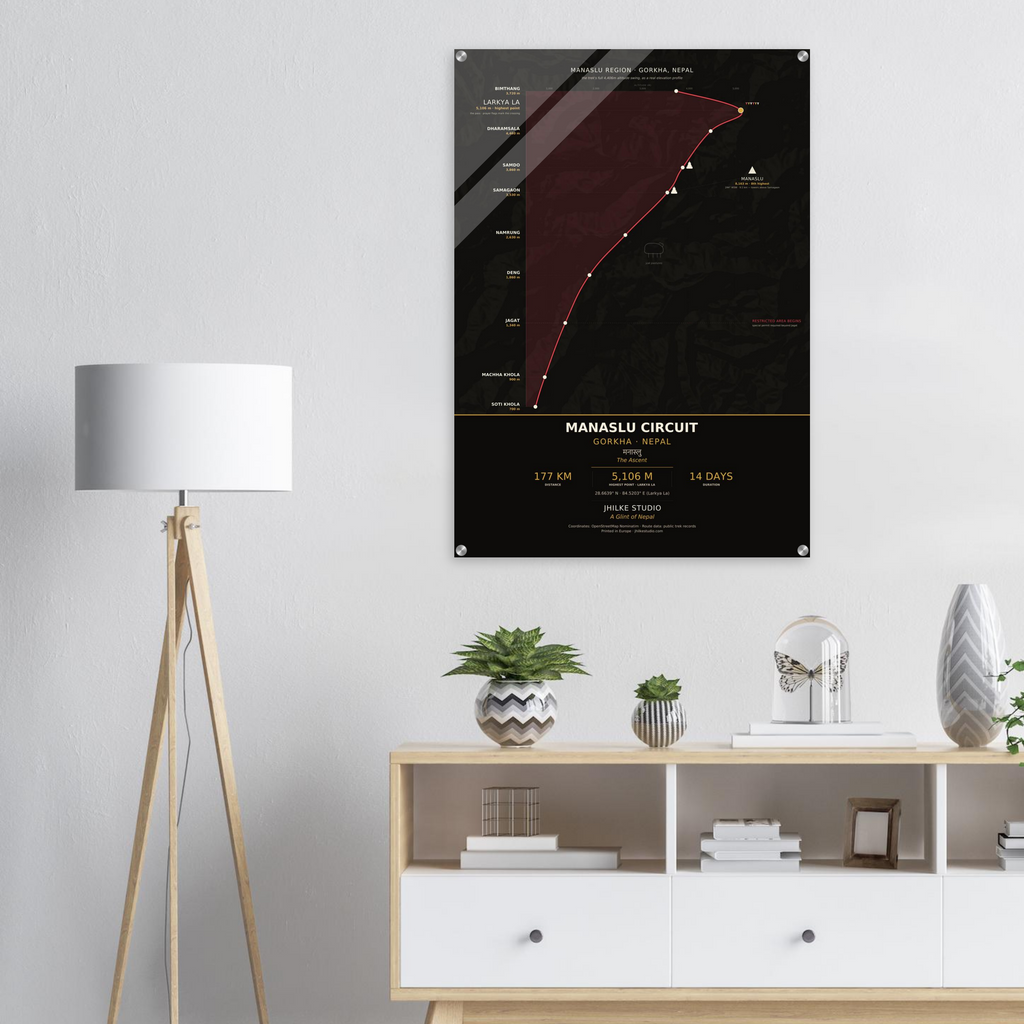 Manaslu Circuit trek route map in the dark colourway, shown as an acrylic glass print mounted on a wall. Jhilke Studio.