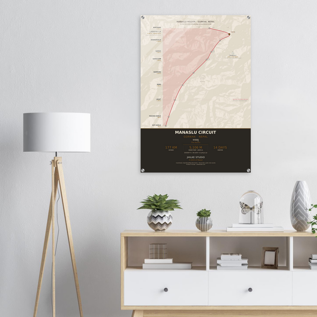 Manaslu Circuit trek route map in the light colourway, shown as an acrylic glass print mounted on a wall. Jhilke Studio.