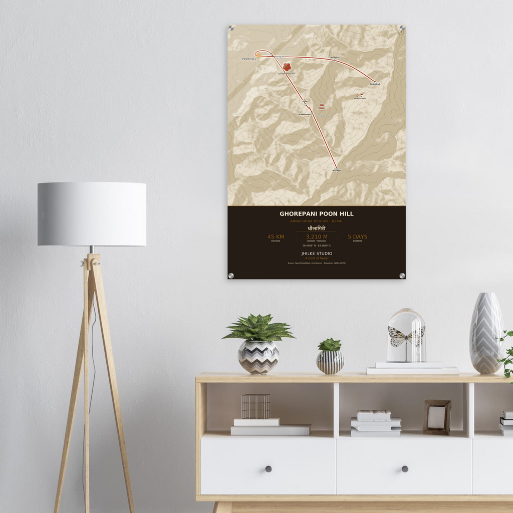 Ghorepani Poon Hill trek route map in the light colourway, shown as an acrylic glass print mounted on a wall. Jhilke Studio.